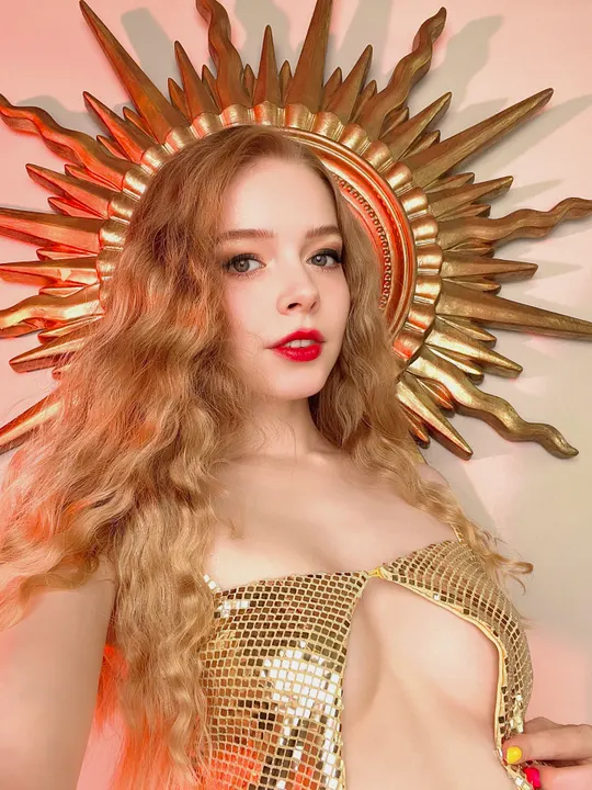 Gold sequin top and a sunburst frame