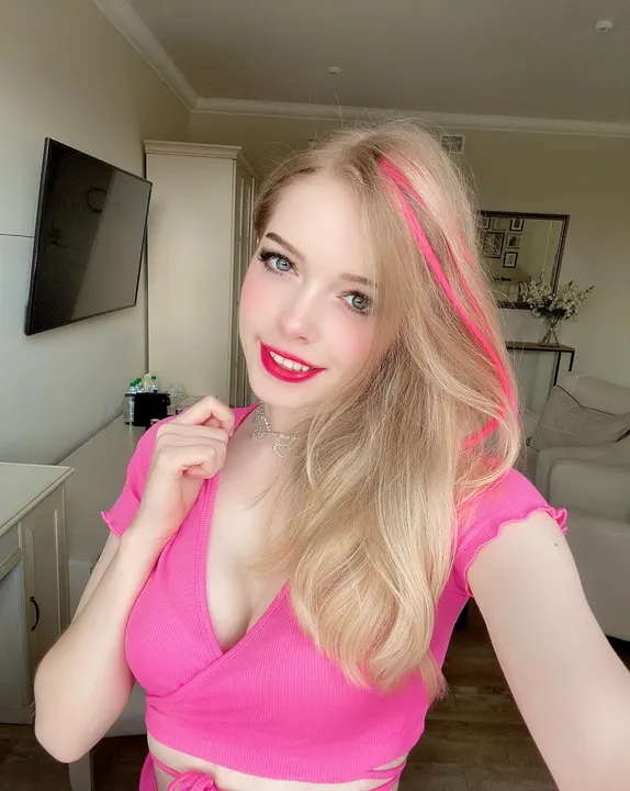 Pink top in a living room