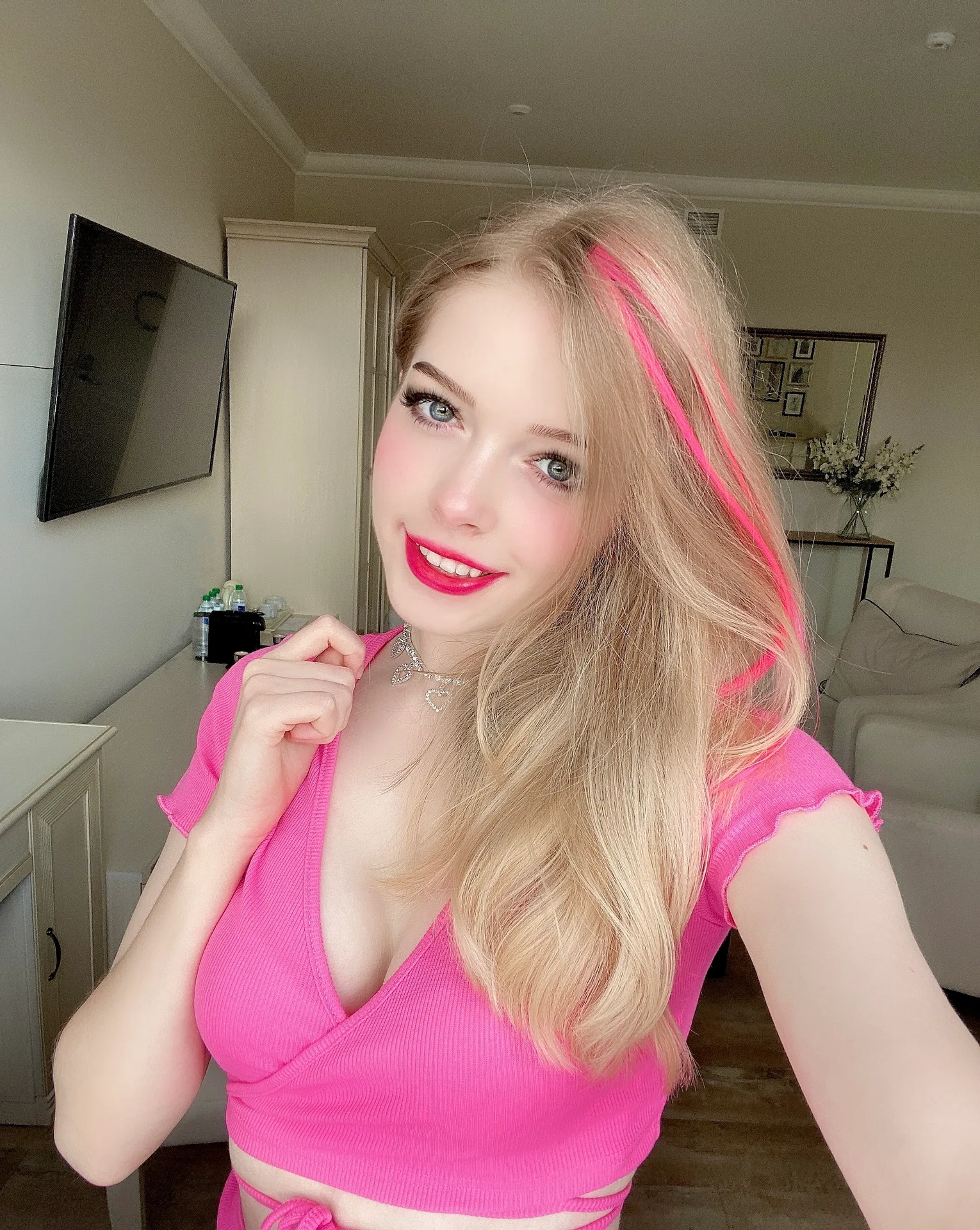 Pink top in a living room