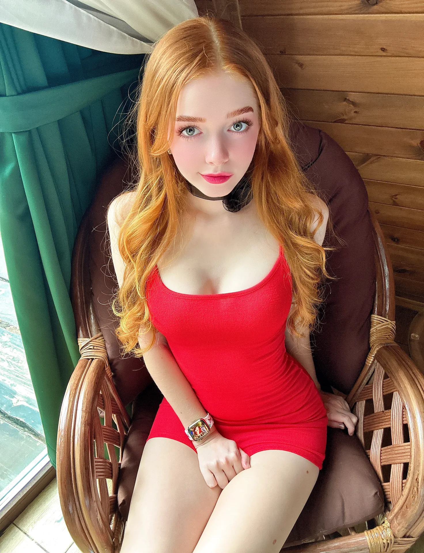Red dress in a wicker chair