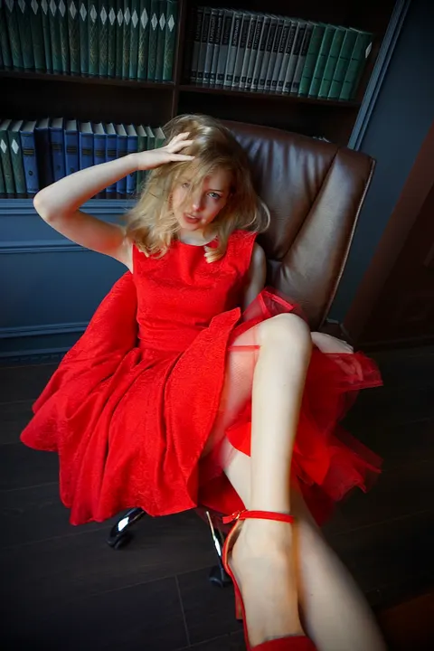 Red dress in an office chair
