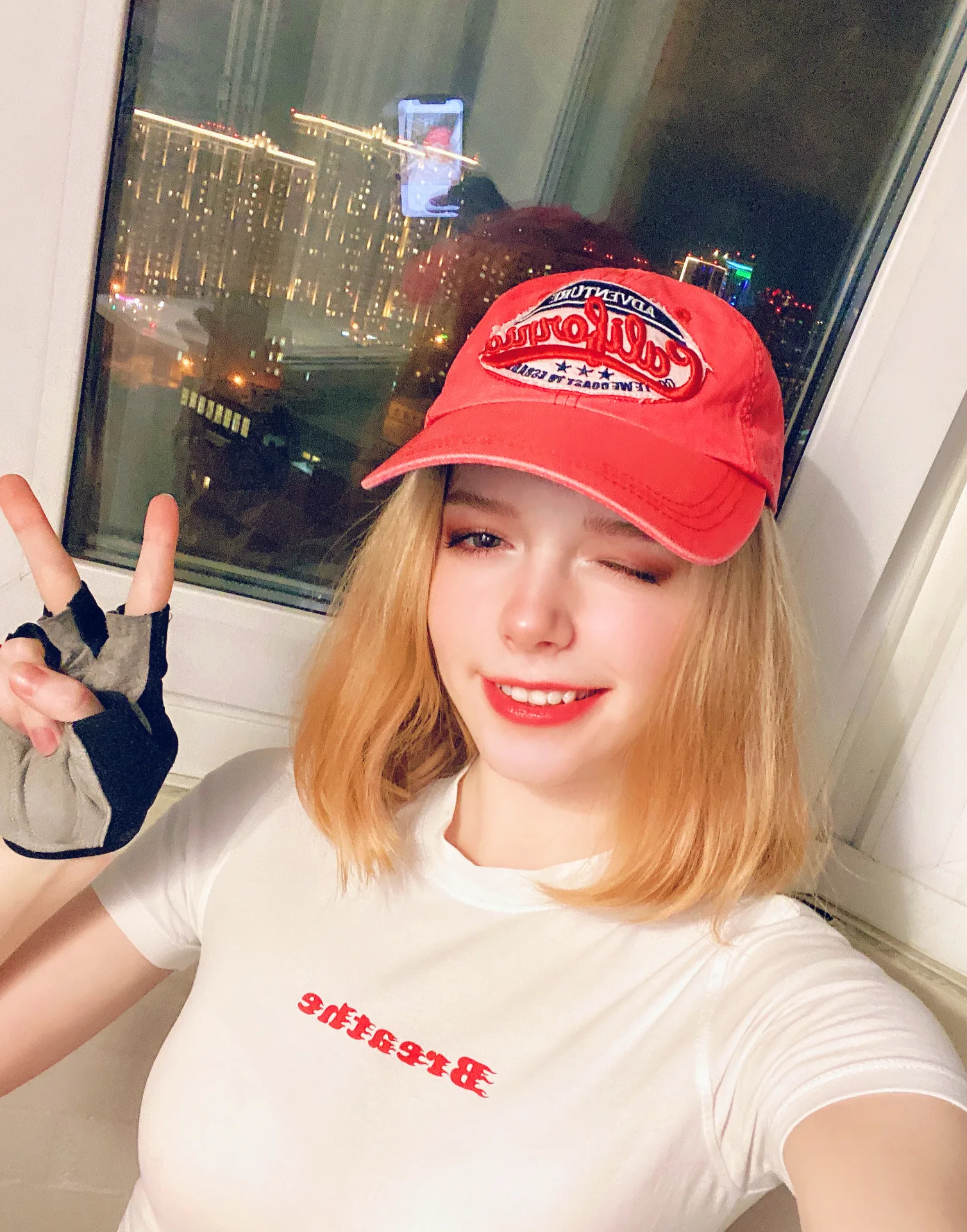 White shirt and red cap